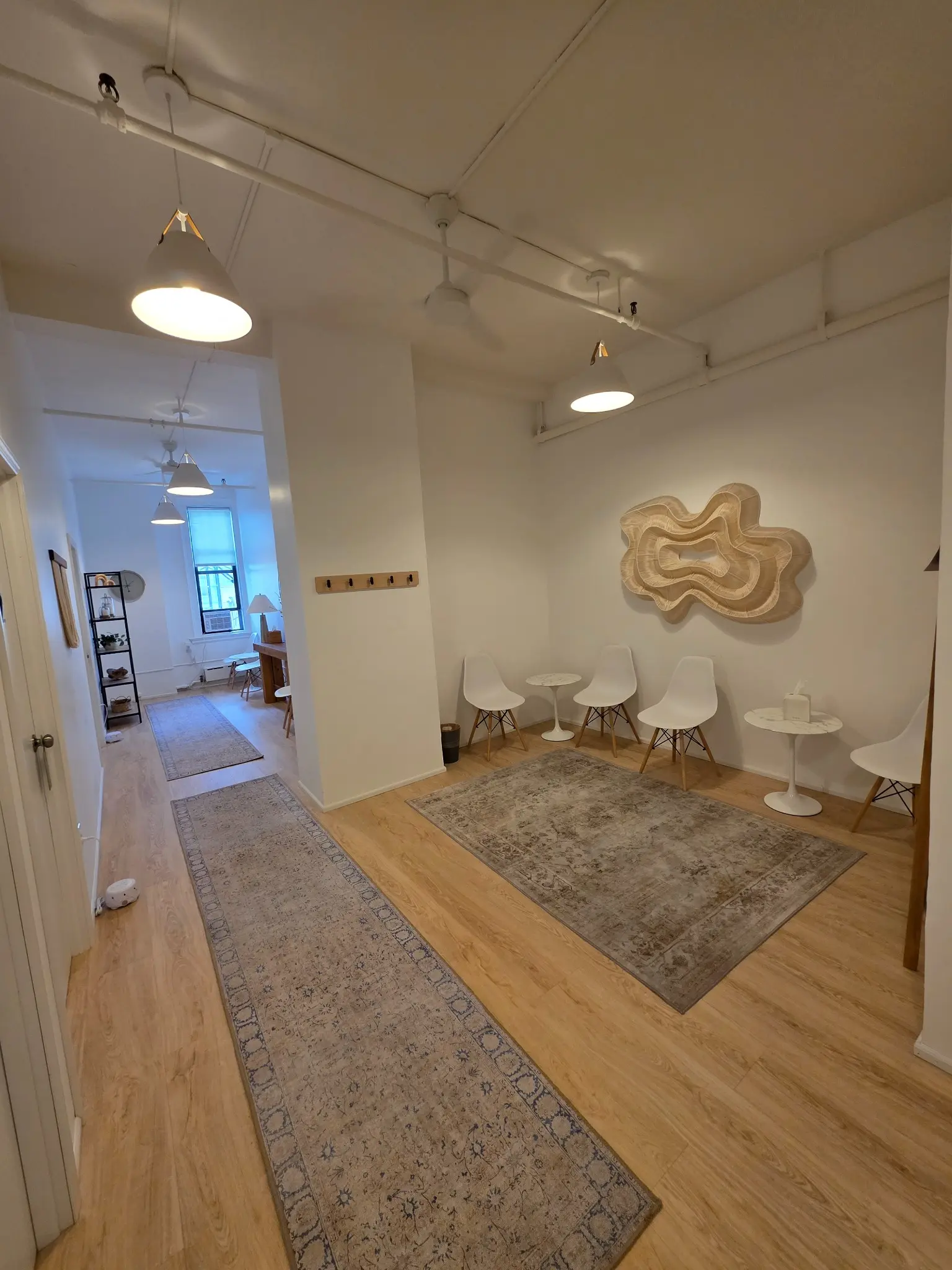 An independently designed tenant waiting area inside 303 Fifth Avenue